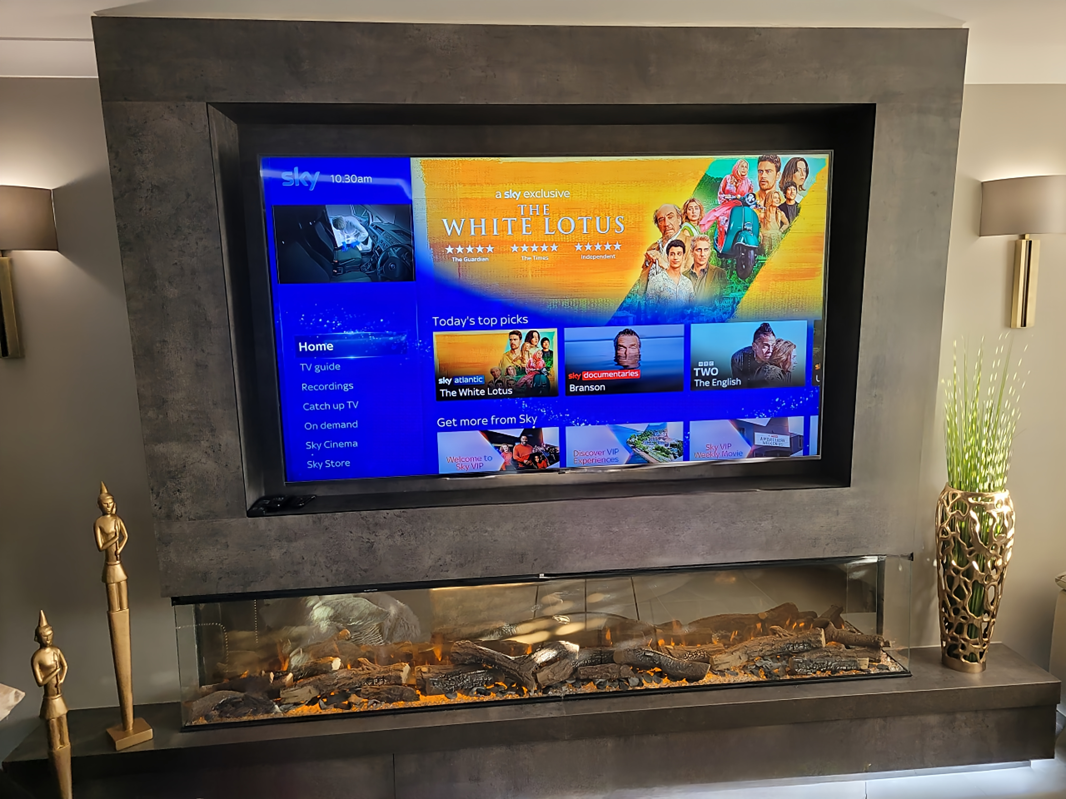 Bespoke media wall with recessed TV and fireplace