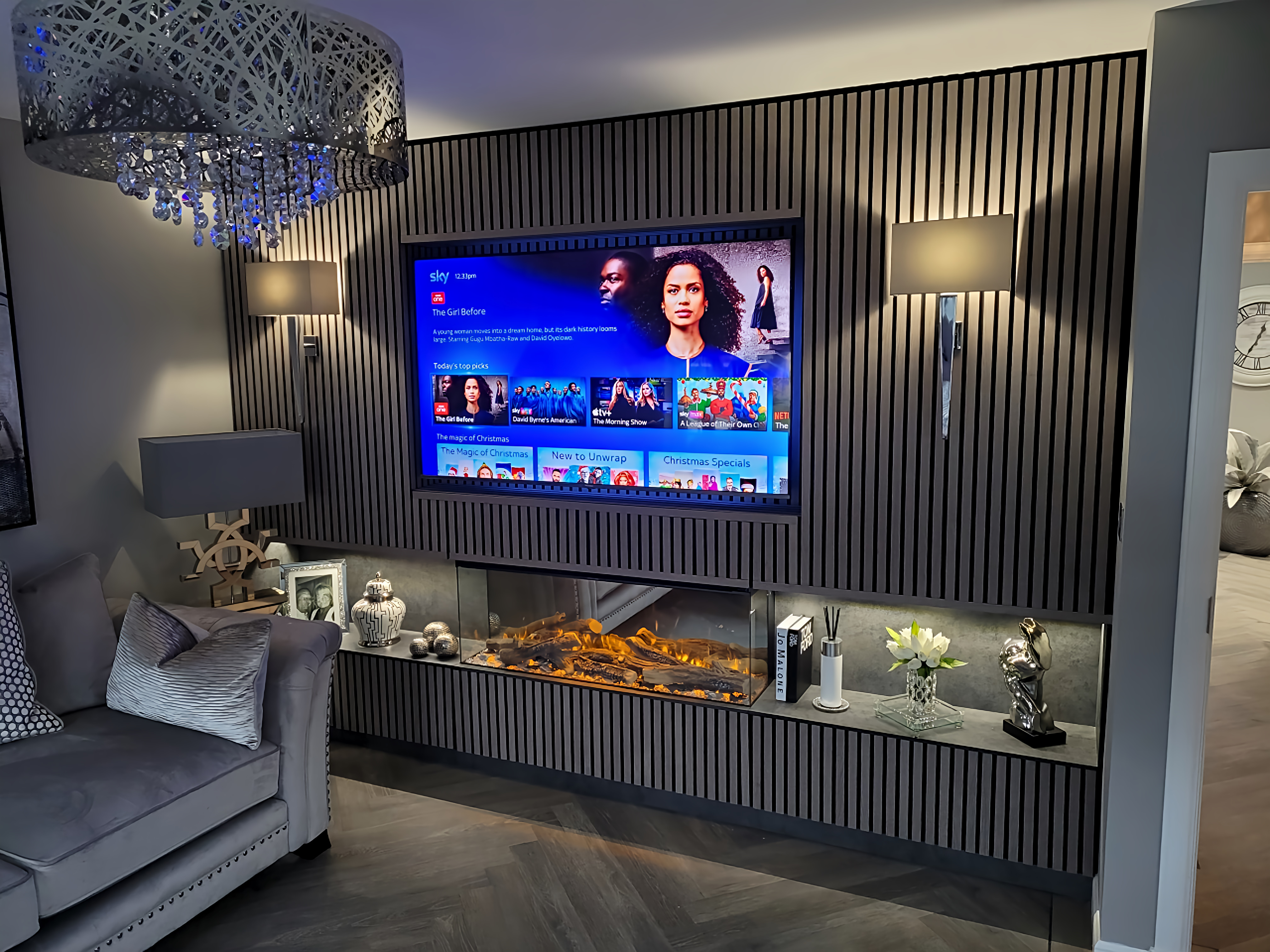 Luxury vertical slat media wall with fireplace